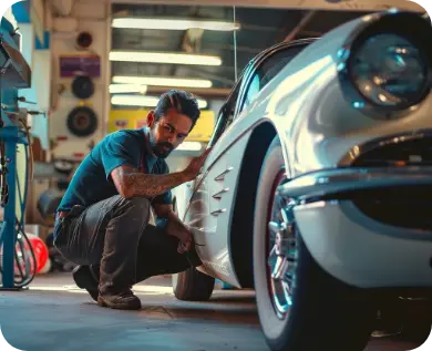 Man admiring the lines of a classic car